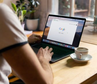 person using black laptop computer